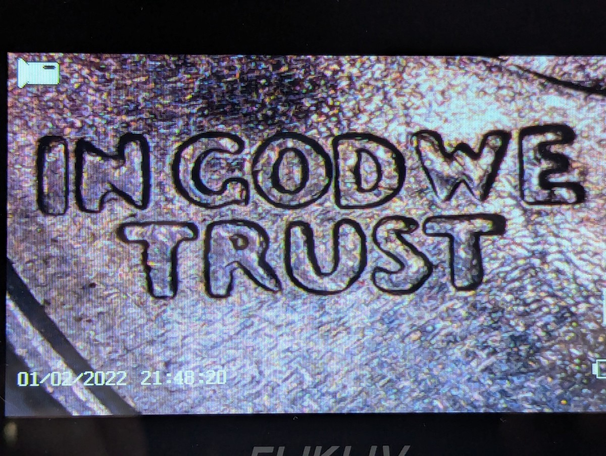 Close-up of 1987-P Washington Quarter Doubled Die Obverse error showing doubling on LIBERTY lettering and IN GOD WE TRUST inscription